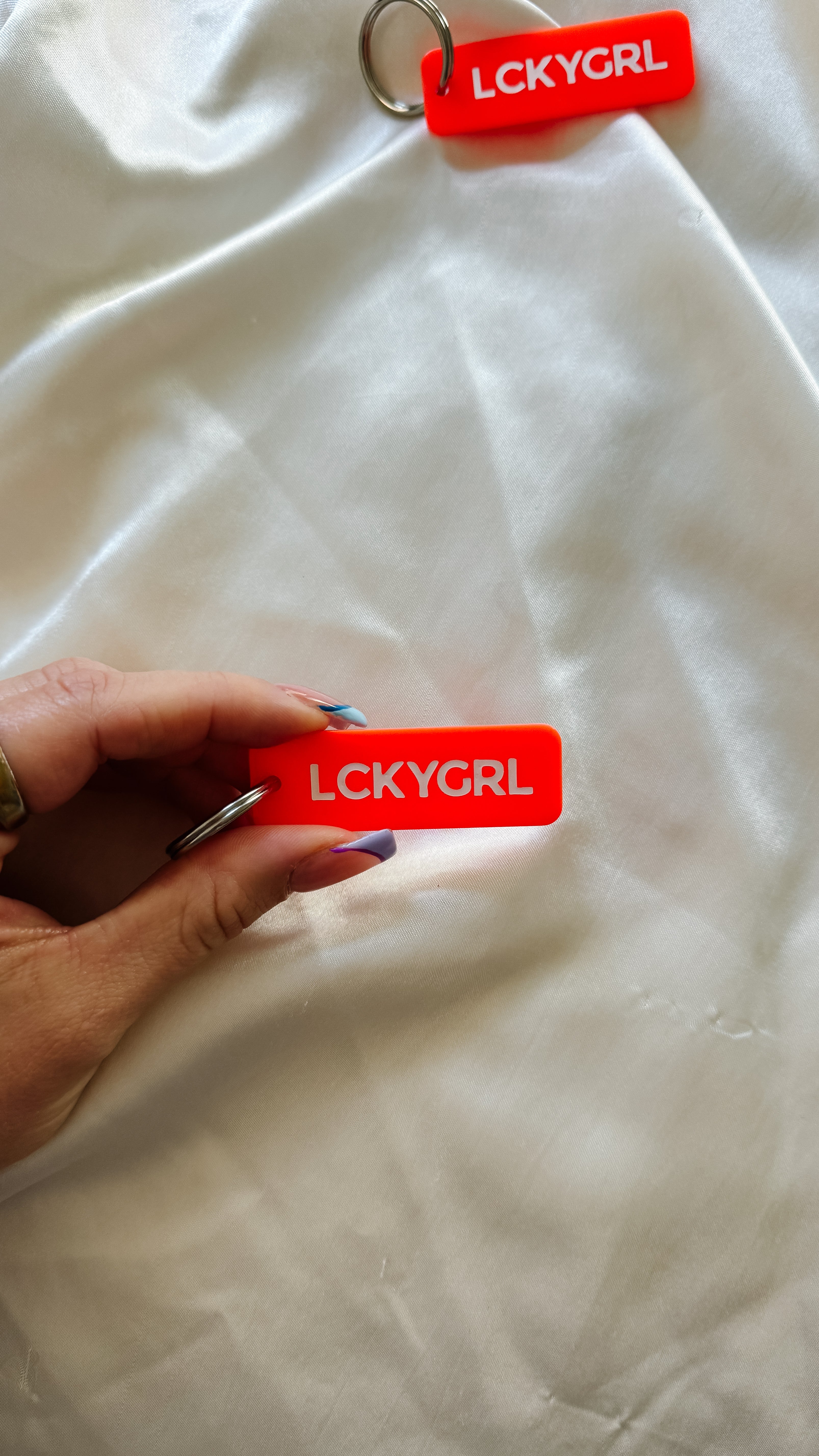 the lucky girl blood orange rectangle keychain