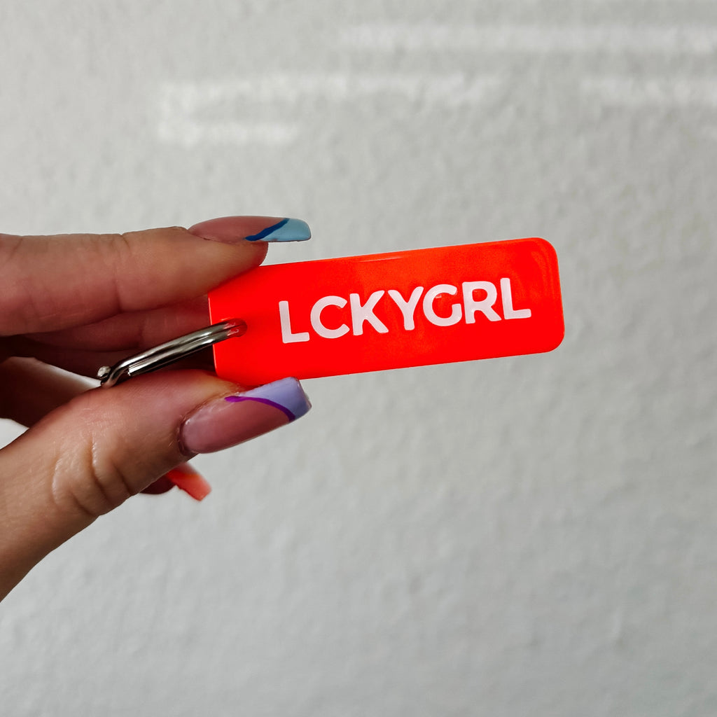 the lucky girl blood orange rectangle keychain