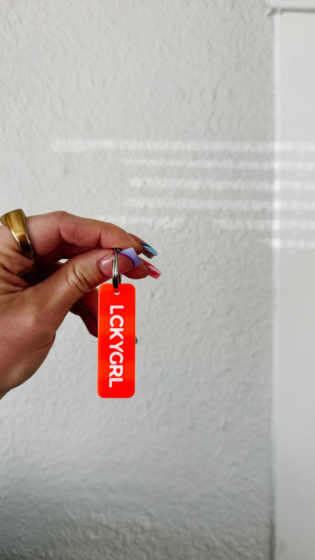 the lucky girl blood orange rectangle keychain