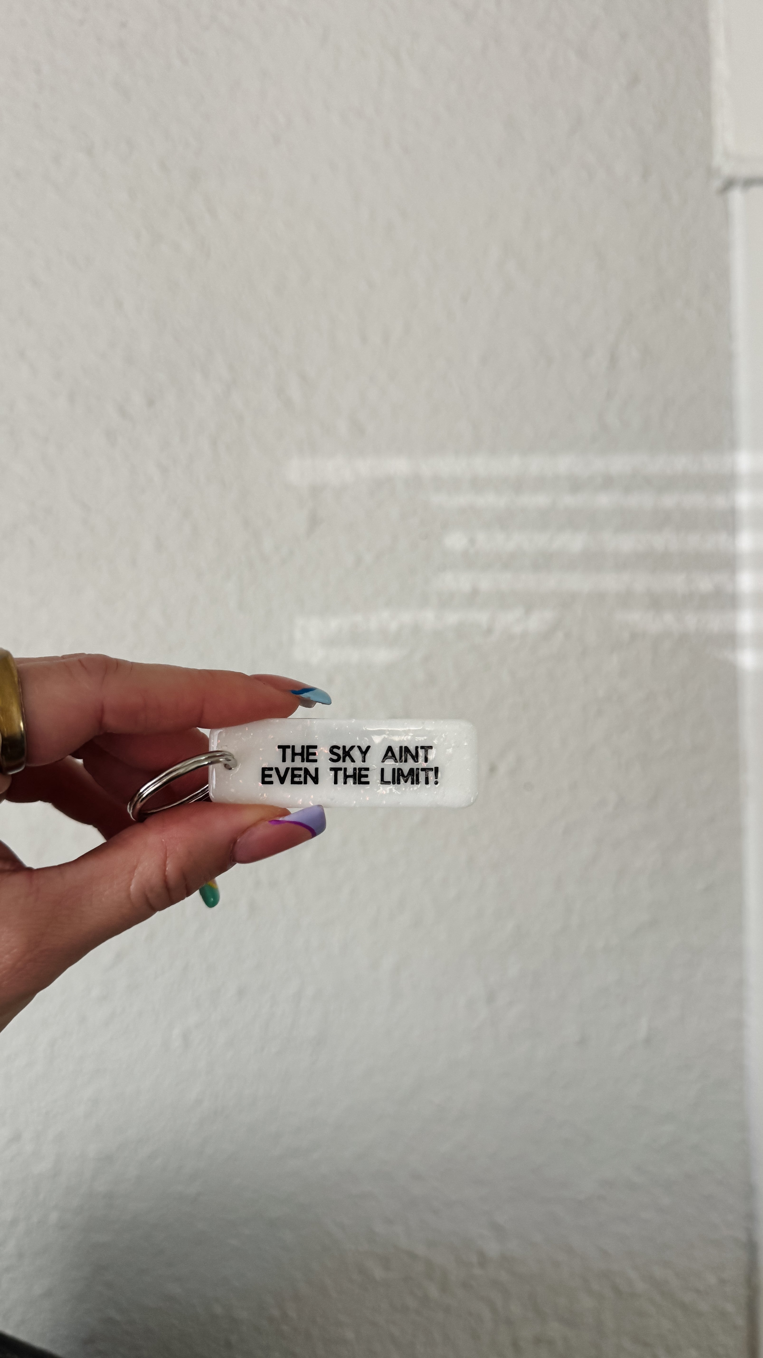 cute white sparkle rectangle keychain / the sky aint even the limit