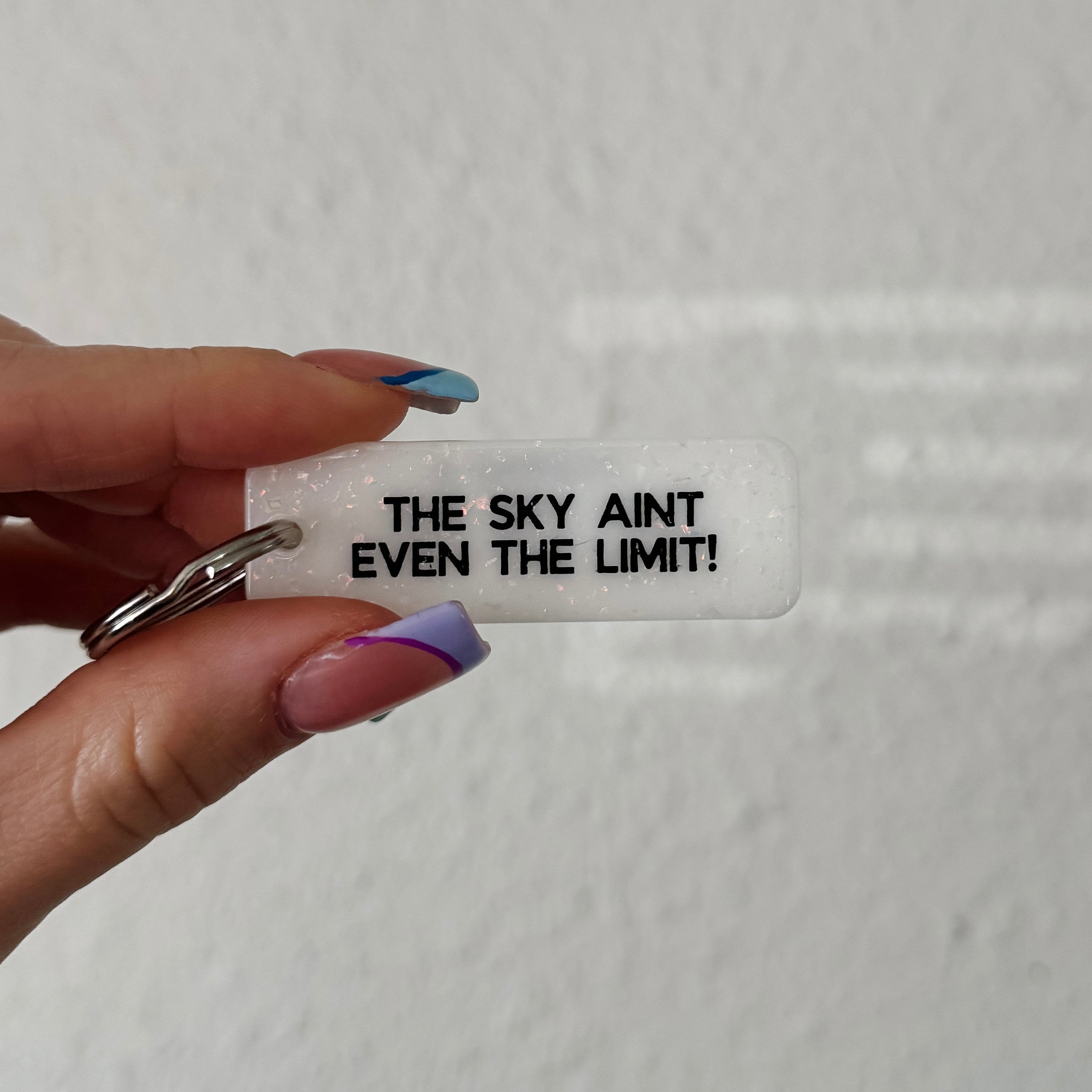 cute white sparkle rectangle keychain / the sky aint even the limit